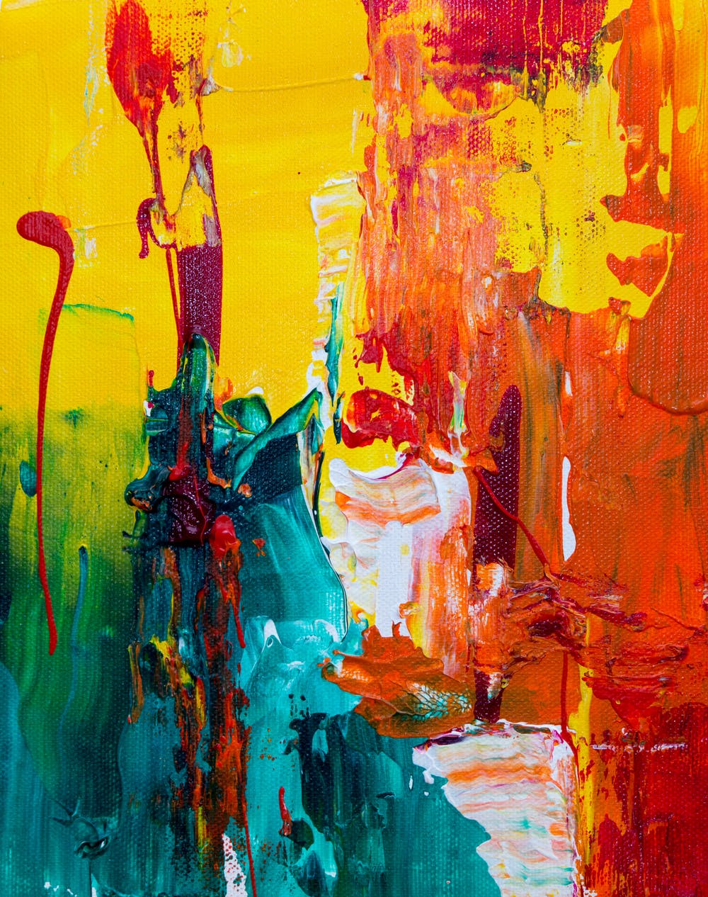 Abstract painting with bright colors of yellow, orange, gold, green, red