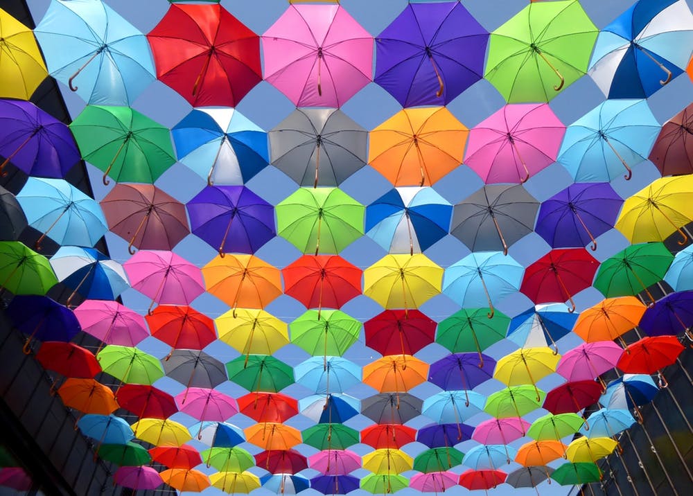 Colorful umbrellas hanging in the sky