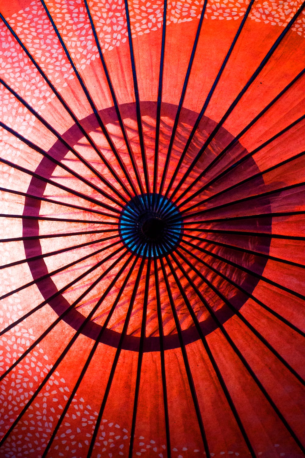 The inside of a red umbrella.